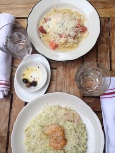 Our food. I ordered the lemon risotto and she ordered linguine with white sauce. The food was delicious and flavorful. 